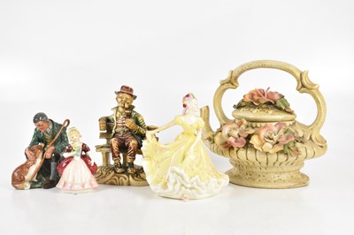 Lot 624 - ROYAL DOULTON; a group of three figures...