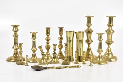 Lot 1492 - A small collection of brass candlesticks,...