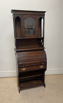 Lot 1026 - An Arts and Crafts style oak roll top bureau...
