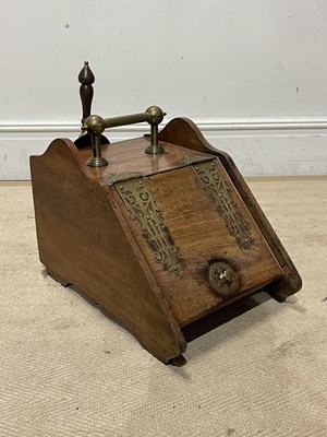 Lot 1282 - A Victorian brass mounted coal scuttle, with...