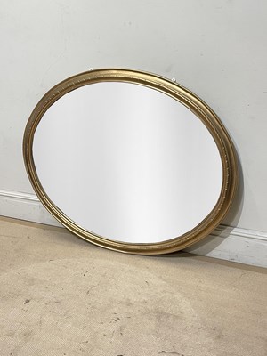 Lot 1020 - A large late 19th century gilt painted oval...