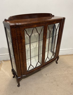 Lot 1216 - An early 20th century walnut display cabinet,...