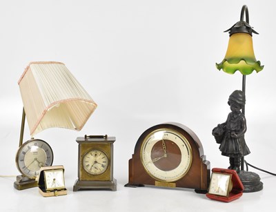 Lot 311 - A silvered metal mantel clock, the dial set...