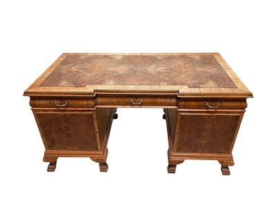 Lot 1238 - A walnut inverted breakfront kneehole desk,...