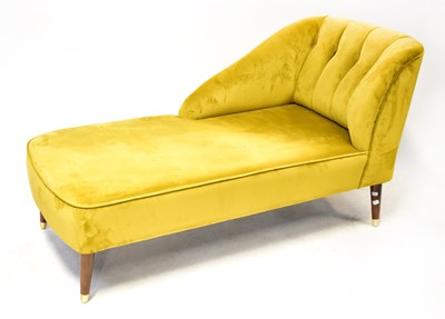 Lot 19 - A modern chaise longue, upholstered in a...