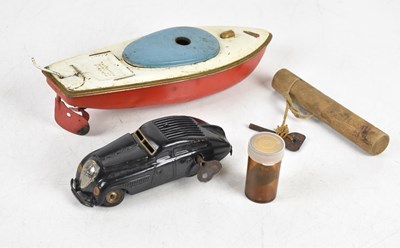Lot 852 - SCHUCO; a vintage clockwork vehicle and a...