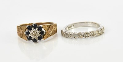 Lot 145 - An 18ct white gold ten stone half eternity...