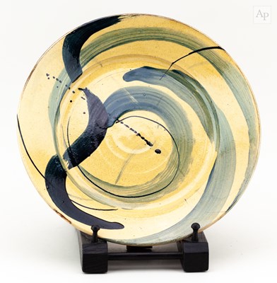 Lot 739 - A slip decorated earthenware plate in the...