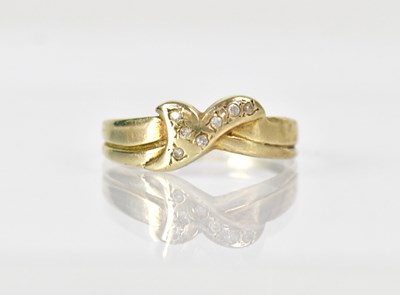 Lot 1039 - A 9ct yellow gold ring set with tiny white...