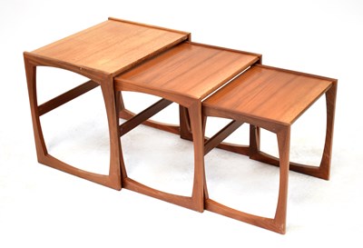 Lot 12 - G-PLAN; a nest of three teak tables, the...
