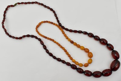 Lot 1367 - Two amber style necklaces, one with facet cut...