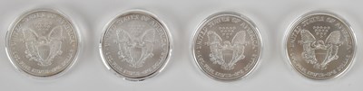 Lot 1445 - Four USA Liberty/Eagle fine silver dollars,...