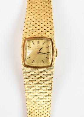 Lot 562 - OMEGA; an 18ct yellow gold lady's wristwatch,...