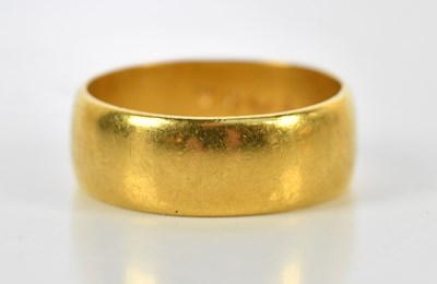 Lot 103 - A 22ct yellow gold wedding band, size N 1/2,...
