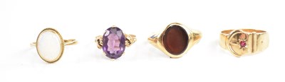 Lot 149 - A 9ct yellow gold buckle ring, size U, and...
