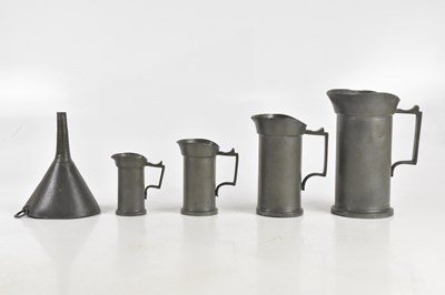 Lot 1488 - Four French pewter measuring jugs, largest,...
