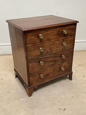 Lot 1245 - A 19th century commode chest, on bracket feet,...