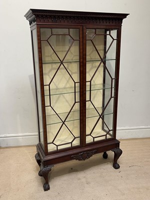 Lot 1161 - A 20th century mahogany twin door display...