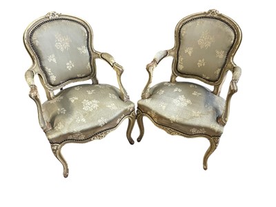 Lot 1175 - A pair of carved and painted French style...