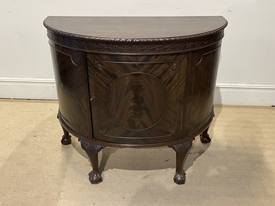 Lot 1239 - An early 20th century mahogany demi-lune...