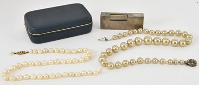 Lot 1358 - Two single strand simulated pearl necklaces,...