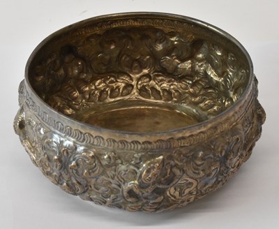 Lot 1070 - A Thai white metal circular bowl, the border...