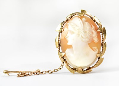 Lot 1074 - A 9ct yellow gold mounted cameo brooch with...