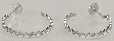 Lot 1242 - A pair of 18ct white gold circular tiny...