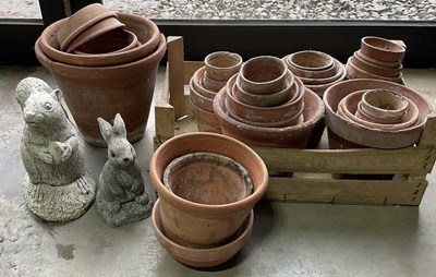 Lot 566 - A quantity of terracotta pots, together with...