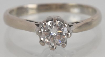 Lot 1125 - An 18ct gold diamond solitaire ring, the claw...