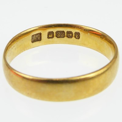 Lot 990 - A 22ct gold band ring, size J, approx. 2.7g.