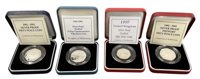 Lot 1459 - Four silver proof fifty pence coins comprising...