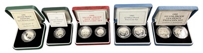 Lot 1429 - ROYAL MINT; five cased sets of silver decimal...