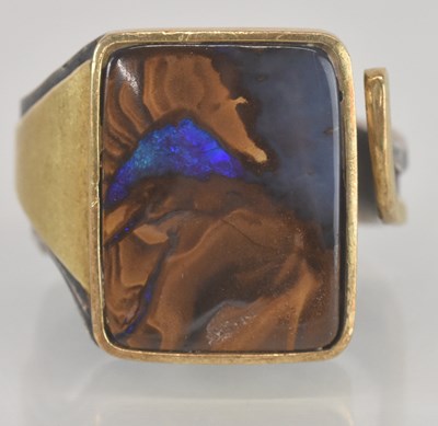 Lot 1183 - A contemporary Australian wood opal ring, the...