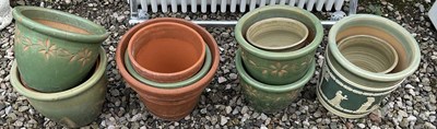 Lot 563 - A quantity of glazed stone ware garden pots,...