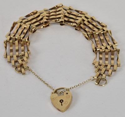 Lot 1305 - A 9ct yellow gold gate link bracelet with...
