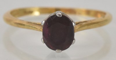 Lot 1131 - An 18ct yellow gold and platinum ruby set ring,...