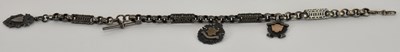 Lot 1336 - A white metal watch chain, suspending three...
