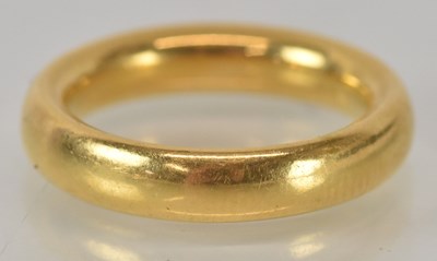 Lot 1147 - A yellow metal wedding band, size I, approx 8.1g.