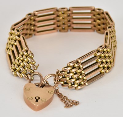Lot 1301 - A 9ct yellow gold gate link bracelet with...