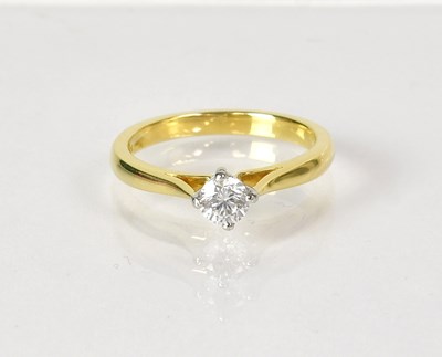 Lot 1026 - An 18ct yellow gold diamond solitaire ring,...