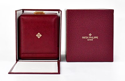 Lot 1149 - PATEK PHILIPPE; a vintage burgundy leather...