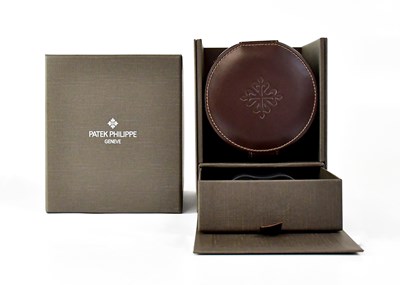Lot 1150 - PATEK PHILIPPE; a brown leather covered watch...