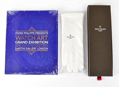 Lot 629 - PATEK PHILIPPE; a boxed pure silk red tie, a...