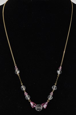 Lot 1219 - A 9ct yellow gold fine link necklace, set with...