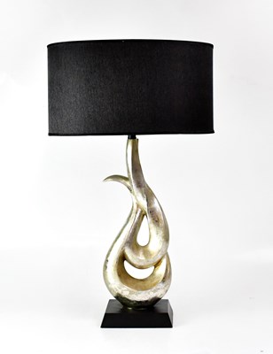 Lot 144 - A metallic sculptural table lamp with black...