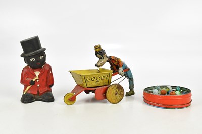 Lot 2438 - A cast iron money bank modelled as a figure...