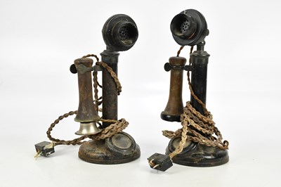 Lot 2314 - Two black painted vintage candlestick telephones.