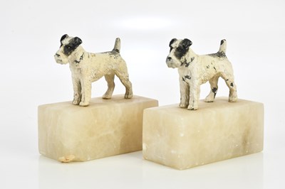 Lot 2390 - A pair of Art Deco patinated spelter terriers...