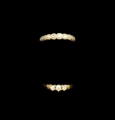 Lot 1172 - Two yellow metal gem set dress rings, the...